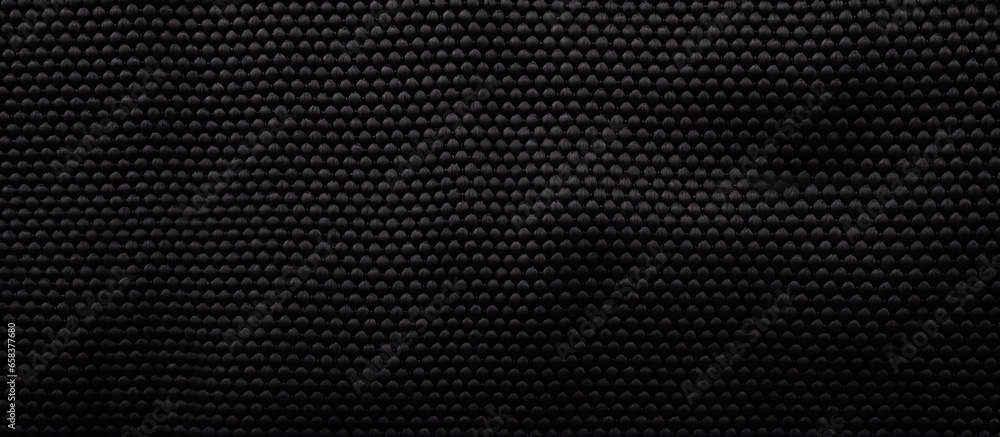 Luxurious fabric surface shown in a black background Luxurious fabric surface shown in a black background