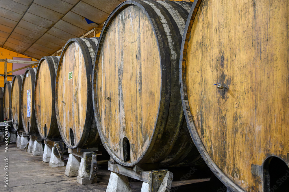 Making of traditional natural Asturian cider made from fermented apples in barrels for several months should be poured from great height, allowing lots of air bubbles into the drink.