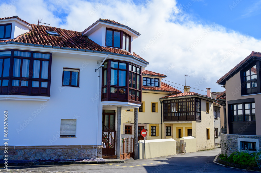 Fototapeta premium Vacation on Green coast of Asturias, views of Llanes touristic city with old harbour, North of Spain