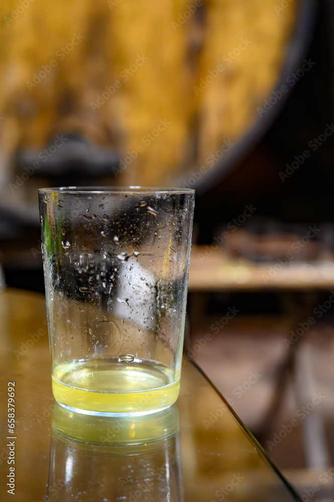 Tasting of traditional natural Asturian cider made from fermented apples in barrels for several months should be poured from great height, allowing lots of air bubbles into the drink. Tasting of traditional natural Asturian cider made from fermented apples in barrels for several months should be poured from great height, allowing lots of air bubbles into the drink.