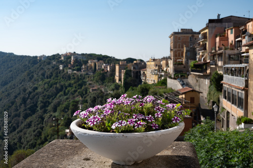 Walking in Castel Gandolfo, summer residence of pope, view on green Alban hills overlooking volcanic crater lake Albano, Castelli Romani, Italy in summer photo