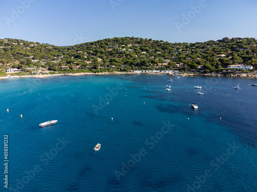 Summer holidays on French Riviera, aerial view on rocks and sandy beach Escalet with crystal clear blue water near Ramatuelle and Saint-Tropez, France photo