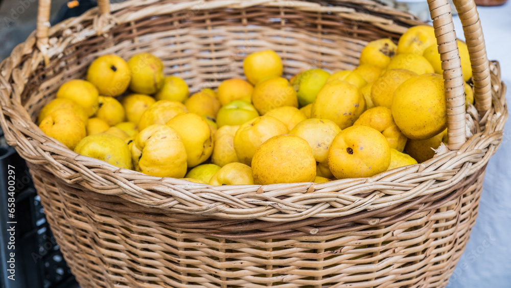 Quince fruits in wicker baskets, top view. Northern lemon