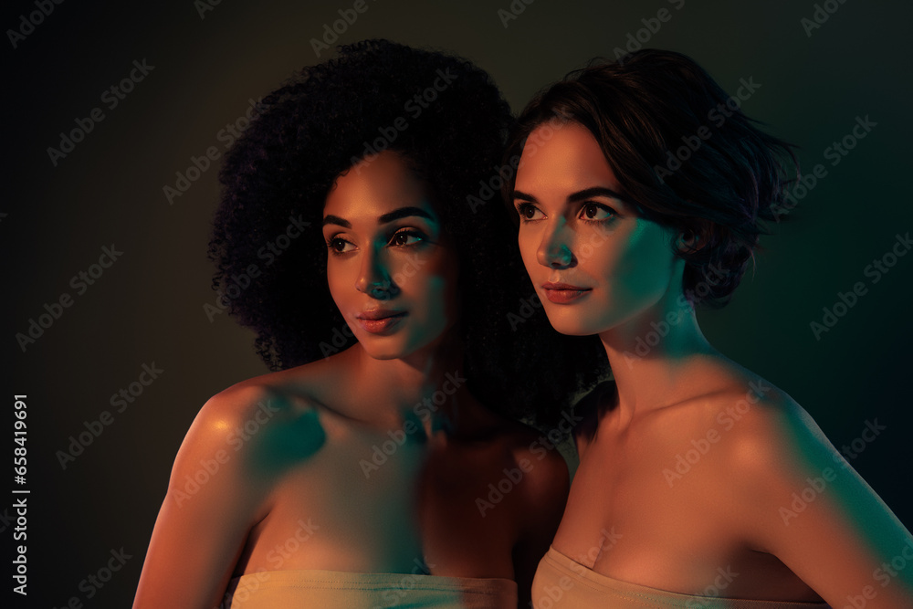 Photo of seductive dreamy ladies naked shoulders looking empty space isolated dark color background Photo of seductive dreamy ladies naked shoulders looking empty space isolated dark color background