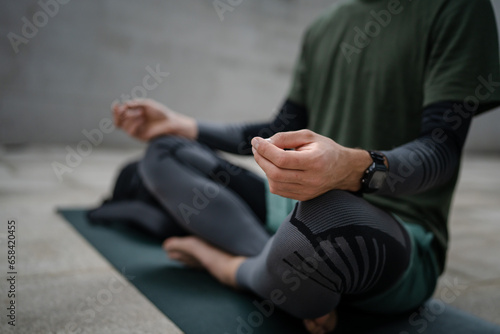 one man doing guided meditation online yoga self care concept outdoor