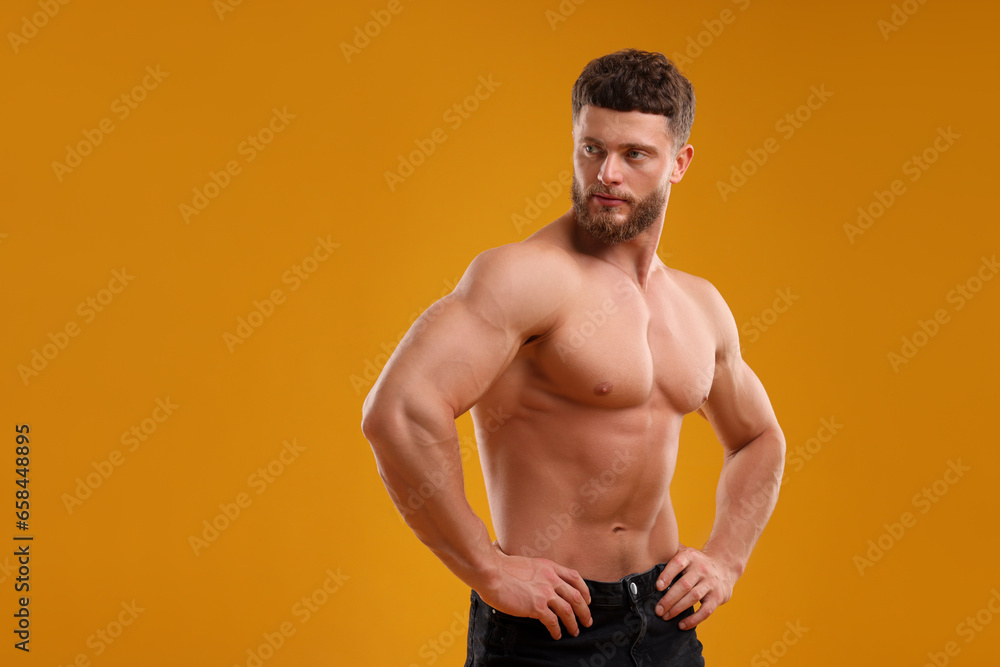 Handsome muscular man on orange background, space for text. Sexy body