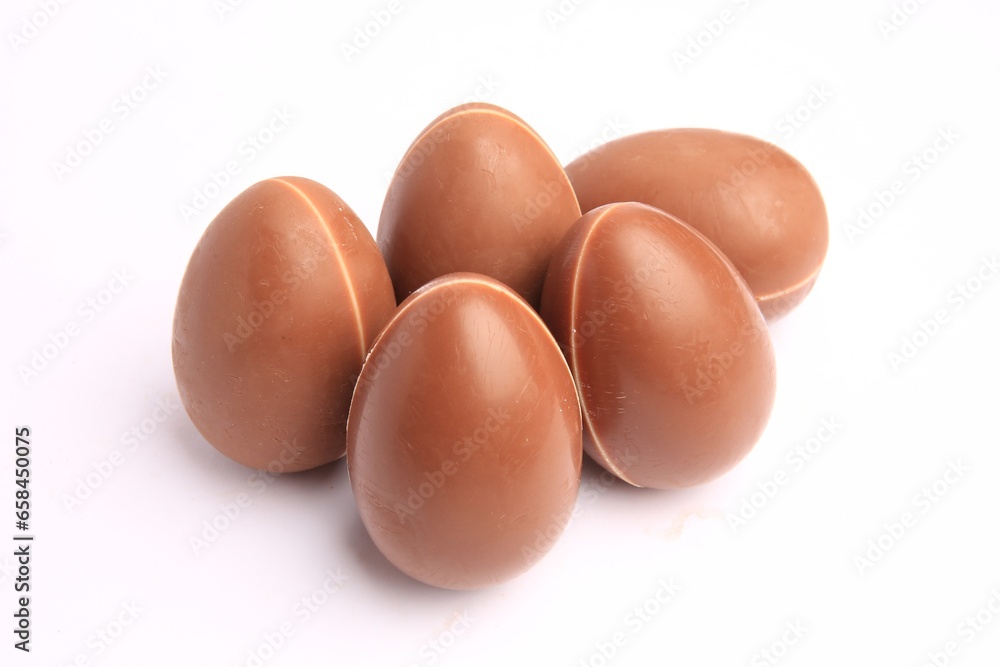 Sveti Vlas, Bulgaria - June 27, 2023: Unwrapped Kinder Surprise Eggs isolated on white Sveti Vlas, Bulgaria - June 27, 2023: Unwrapped Kinder Surprise Eggs isolated on white