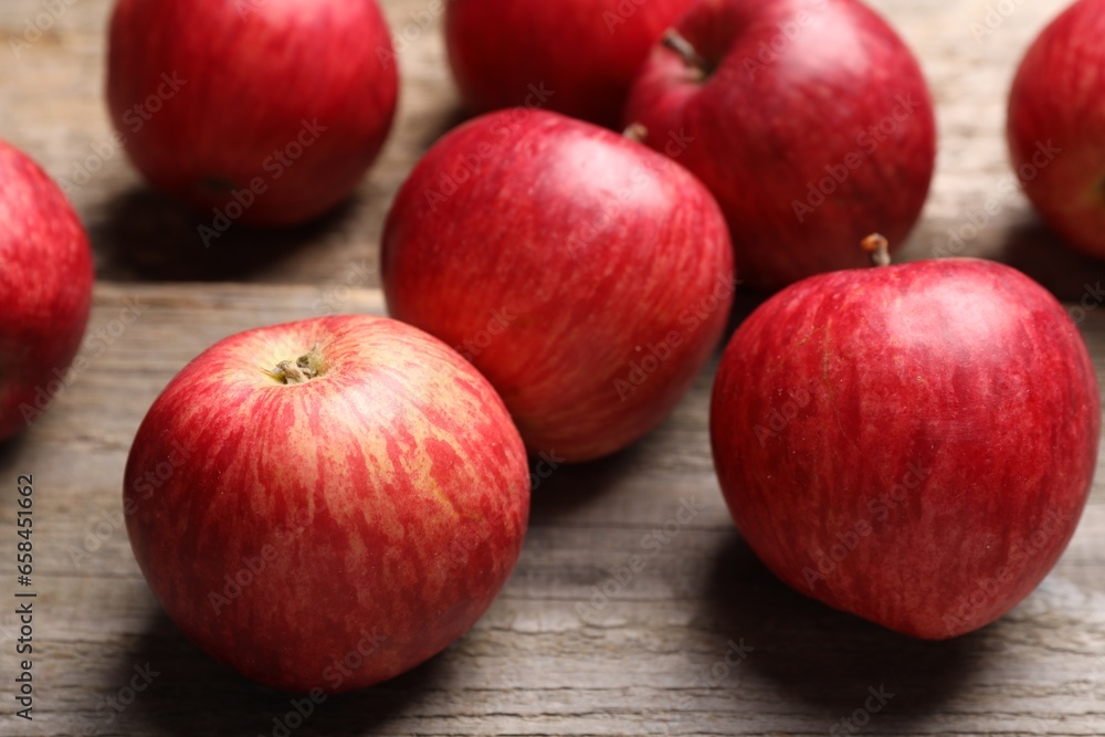Fresh red apples on wooden table, closeup Fresh red apples on wooden table, closeup