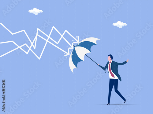 Protection or defensive stock in economy crisis or market crash, business resilient to survive difficulty or insurance concept, businessman holding umbrella to cover and protect from downturn arrow.