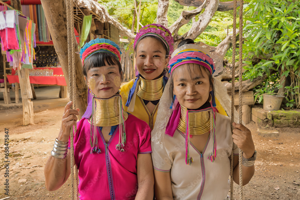 Φωτογραφία portrait of Karen women from Pai at Mae Hong Son, Thailand sitting on wooden swi
