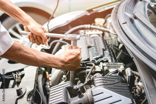 Repairman working in garage. Repair service.
