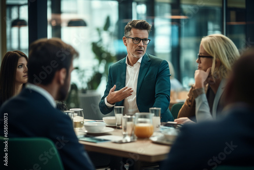 Business, lifestyle concept. Executive man speaking to group of people in office. Business man surrounded with colleagues employees listening speech. Generative AI