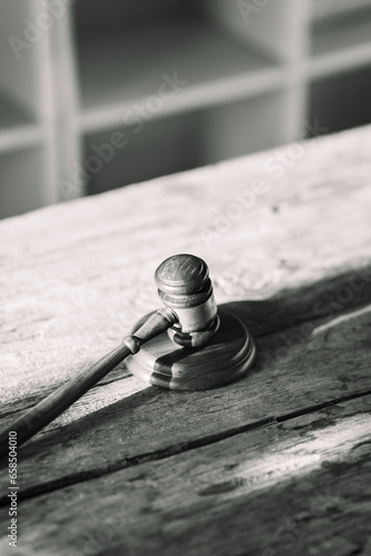 Wooden legal gavel on wooden table, judge hammer for final verdict It represents the rights and freedoms of human beings.