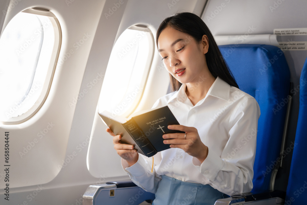 Reading a book, Thoughtful asian people female person onboard, airplane window, perfectly capture the anticipation and excitement of holiday travel. chinese, japanese people.