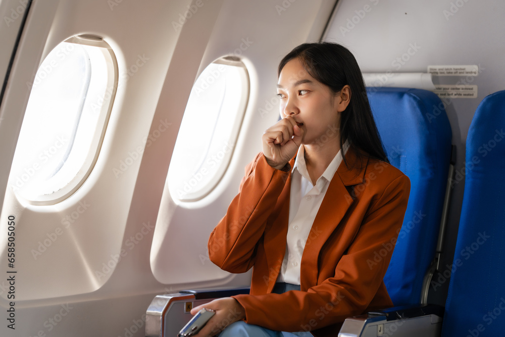 Φωτογραφία Female asian chinese japanese people passenger experiencing airsickness, clenching sick bag and looking uneasy mid-air