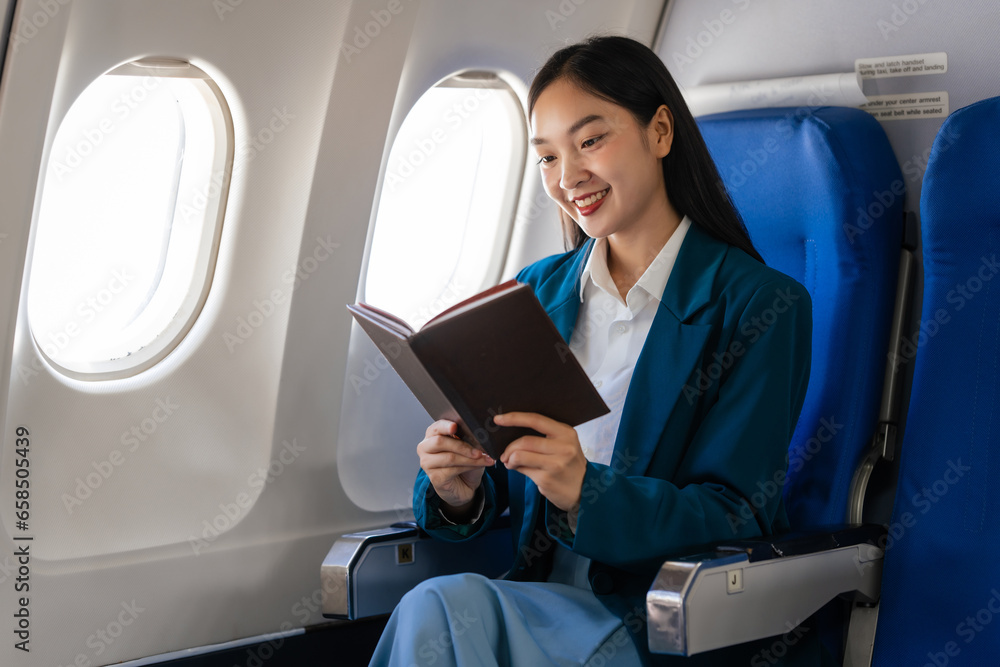 Young asian chinese japanese people female adventurer in-flight, mapping out destinations as she voyages worldwide. woman passenger of airplane. travel around the world.