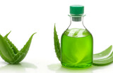 Aloe vera gel in  oil bottle on white background