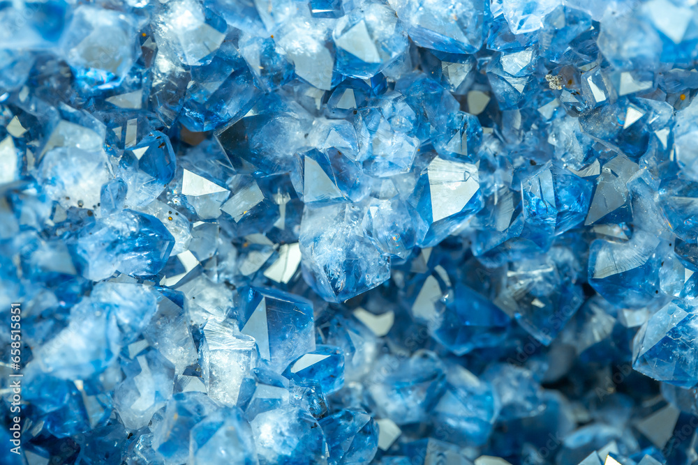 Blue Crystal Mineral Stone. Gems. Mineral crystals in the natural environment. Texture of precious and semiprecious stones. Seamless background with copy space colored shiny surface of precious stones Blue Crystal Mineral Stone. Gems. Mineral crystals in the natural environment. Texture of precious and semiprecious stones. Seamless background with copy space colored shiny surface of precious stones