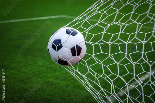 soccer ball on goal with net background © anekoho