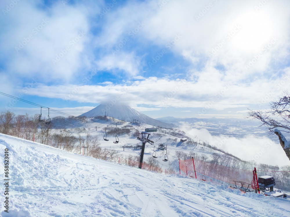 Seeing snowy volcano from ski slope (Niseko, Hokkaido, Japan)