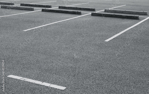 Empty parking lot with white marking lines.