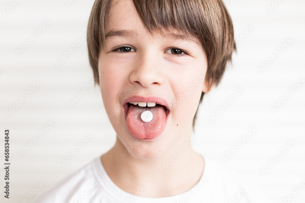 Vitamins and supplements pills for kids. Medicine concept. Toddler boy eating pills and supplement vitamins for better immunity. Child taking medicines pills. Medical concept. Vitamins and supplements pills for kids. Medicine concept. Toddler boy eating pills and supplement vitamins for better immunity. Child taking medicines pills. Medical concept.
