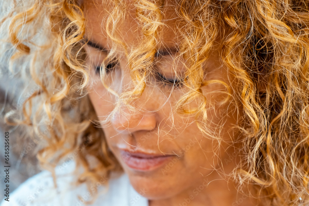 Close up portrait of sad and lonely adult woman with closed eyes and curly hair. Unhappy concept lifestyle female mature people in outdoor. Disappointed lady with sad expression on face. Mental health