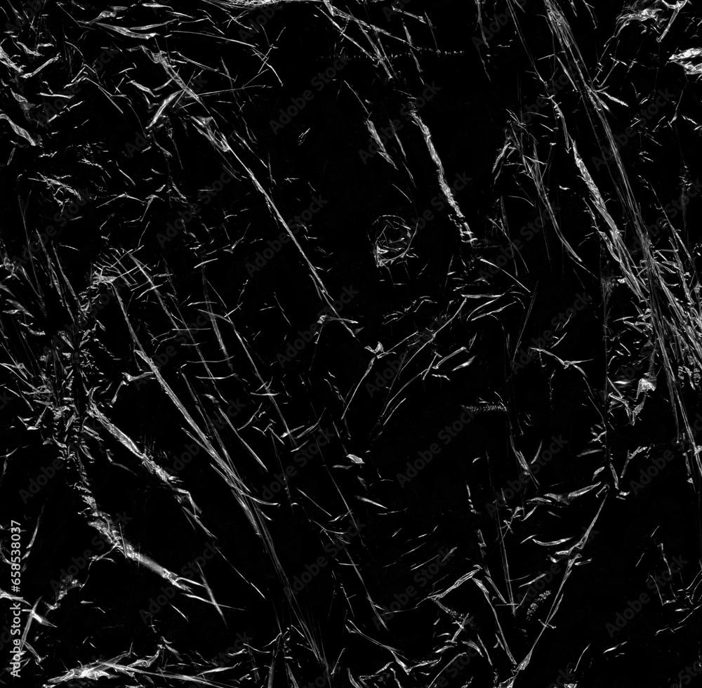 Wrinkled plastic wrap texture on a black background wallpaper. Royalty high-quality free stock photo image of realistic plastic wrap for overlay, copy space and photo effect. Wrinkled plastic surface Wrinkled plastic wrap texture on a black background wallpaper. Royalty high-quality free stock photo image of realistic plastic wrap for overlay, copy space and photo effect. Wrinkled plastic surface