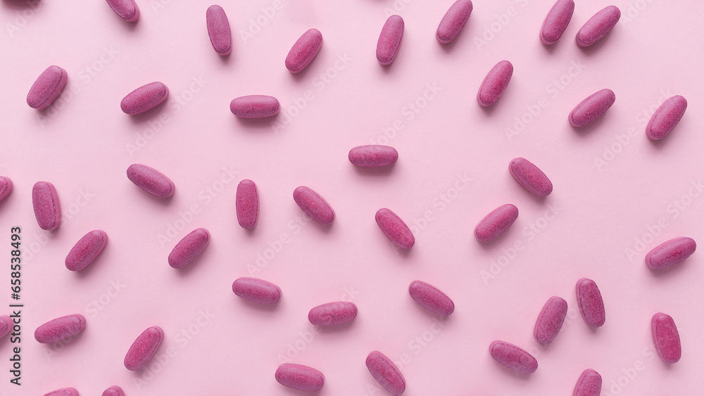 Pink pills Supplements and Vitamins for womens health. Medical health concept. Banner packground. Flat lay. Copy space Pink pills Supplements and Vitamins for womens health. Medical health concept. Banner packground. Flat lay. Copy space