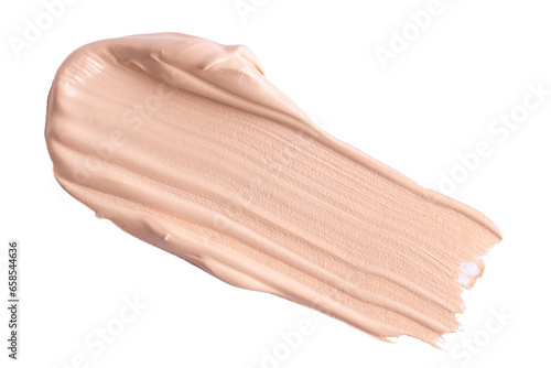 A smear of foundation cream or concealer isolated on white background, macro. Texture of cosmetic liquid foundation or beige cream smudge, smear, stroke.