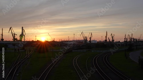 Sunset at the shipping port, all the work is over and the last train is going home