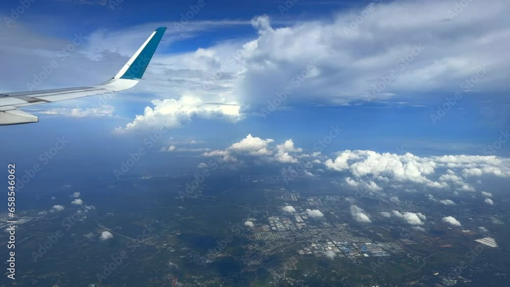 View from plane window. Flying past clouds. Air travel over Vietnam. View from plane window. Flying past clouds. Air travel over Vietnam.