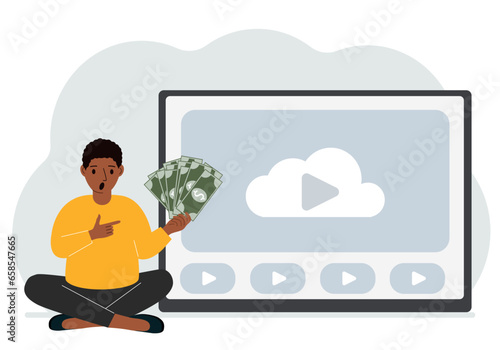 A man holds paper banknotes in his hand, next to a computer with a video. Freelancer, earning money, working on the Internet, training, coaching, business, remote work.
