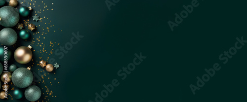 Top view of Christmas tree decorations, toys, balls and confetti on a green surface with empty space for text. Merry Christmas and Happy New Year concept.