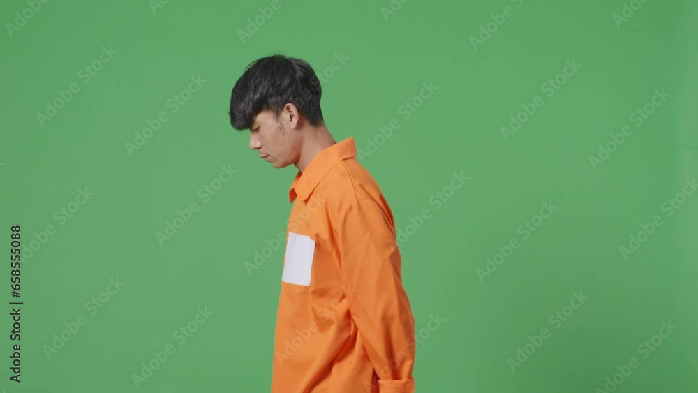 Side View Of Asian Male Prisoner In Handcuffs Walking On The Green Screen Background
Side View Of Asian Male Prisoner In Handcuffs Walking On The Green Screen Background