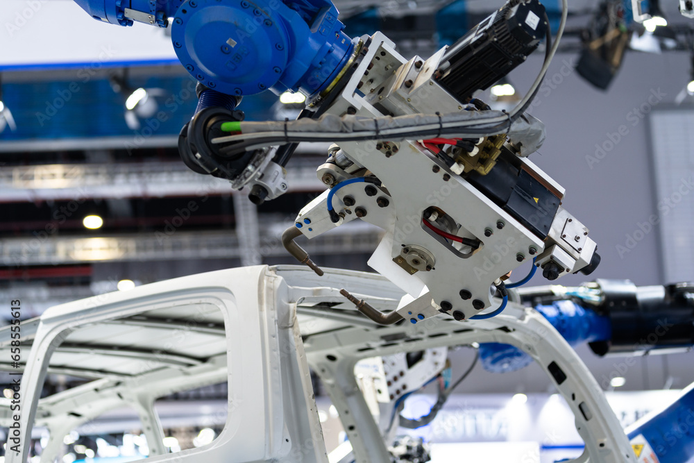robot arm working in car factory robot arm working in car factory