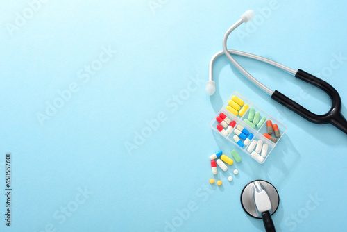 Medicines and stethoscopes on a blue background
