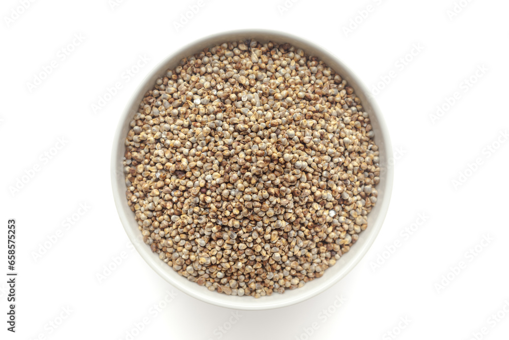 Organic Pearl Millet (Pennisetum glaucum) or Bajra in a white ceramic bowl. Isolated on a white background. Top View Organic Pearl Millet (Pennisetum glaucum) or Bajra in a white ceramic bowl. Isolated on a white background. Top View