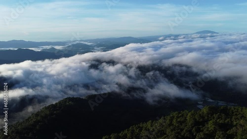 Wallpaper Mural Aerial view over the mountains with sea of fog during morning sunrise in blue sky. Sea of clouds around mountain peaks at sunrise. Unseen travel in Northern Thailand Torontodigital.ca