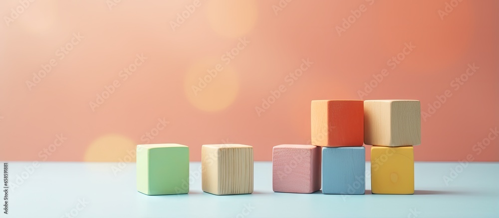 Wooden blocks in geometric shapes for toddlers isolated on a isolated pastel background Copy space Wooden blocks in geometric shapes for toddlers isolated on a isolated pastel background Copy space