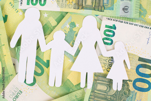 Basic child benefit, family and money, Euro banknotes, new regulation against poverty in Germany, social issue