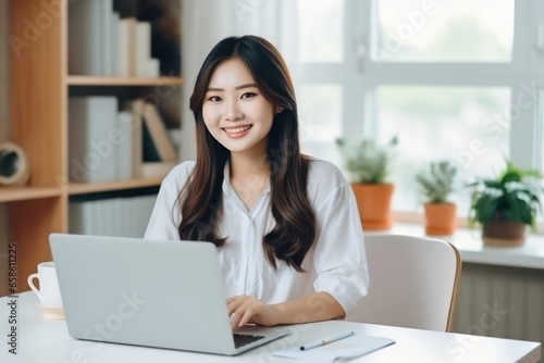 portrait of a businesswoman working on a laptop © KimlyPNG