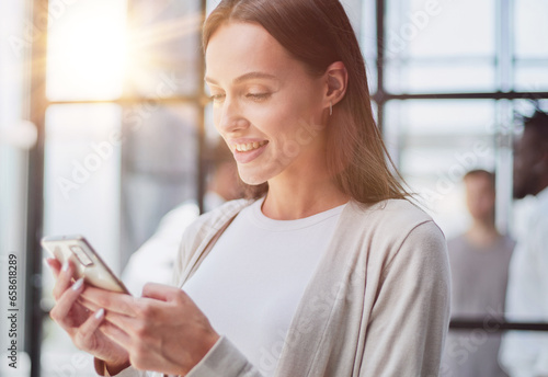 Businesswoman with phone in modern office Free Download Businesswoman with phone in modern office - GFXLoad