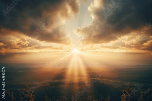 A picturesque scene of the sun shining through the clouds over a beautiful valley. This image can be used to depict a peaceful and serene landscape.