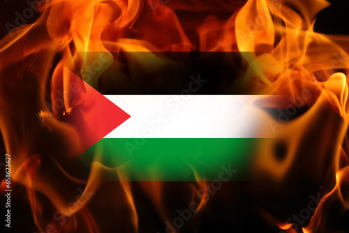 close up view of the flag of Palestine waving in the flame. Palestine Israel war. Banner for design. Flame and fire. Palestine flag background photo
