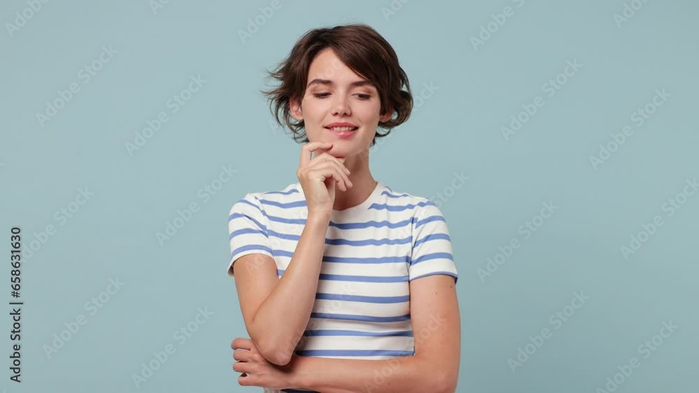 Excited smart proactive puzzled pensive young woman wear striped t-shirt casual clothes look around think scratche at temple comes up with idea raised finger get plan isolated on plain blue background Excited smart proactive puzzled pensive young woman wear striped t-shirt casual clothes look around think scratche at temple comes up with idea raised finger get plan isolated on plain blue background