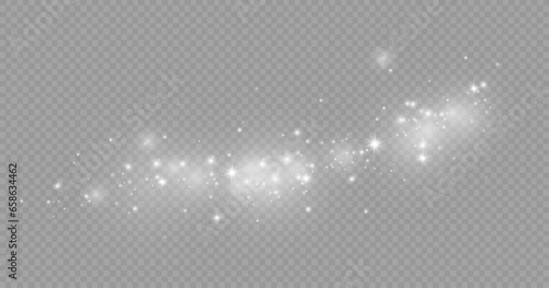 Dust sparks and stars shine with a special light. Christmas light effect. Glittering particles of magic dust.Vector sparkles on a transparent background.