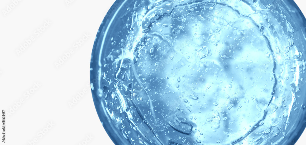Transparent blue cosmetic gel in a round jar. View from above. On an light background. Transparent blue cosmetic gel in a round jar. View from above. On an light background.