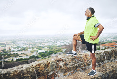Hiking, view or senior man on mountain in nature for trekking journey or freedom adventure or wellness. Relax, holiday or mature hiker by rocks, urban sky or cliff for exercise, fitness or banner