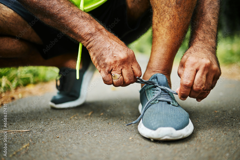 Man, tie and shoes in fitness for running, workout or outdoor exercise on road, street or asphalt. Closeup of male person, hands and tying shoe getting ready or preparation for sports, cardio or run Man, tie and shoes in fitness for running, workout or outdoor exercise on road, street or asphalt. Closeup of male person, hands and tying shoe getting ready or preparation for sports, cardio or run
